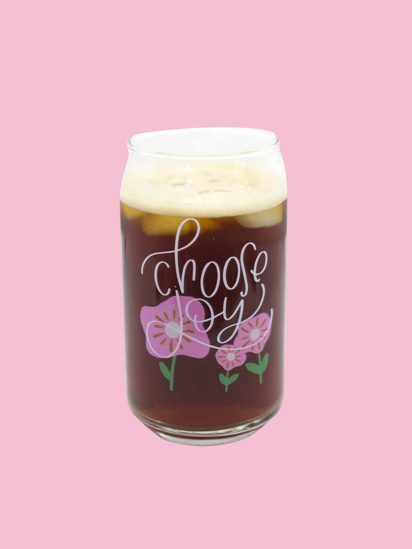 A clear can-shaped glass with 'choose joy' and floral design printed on it.