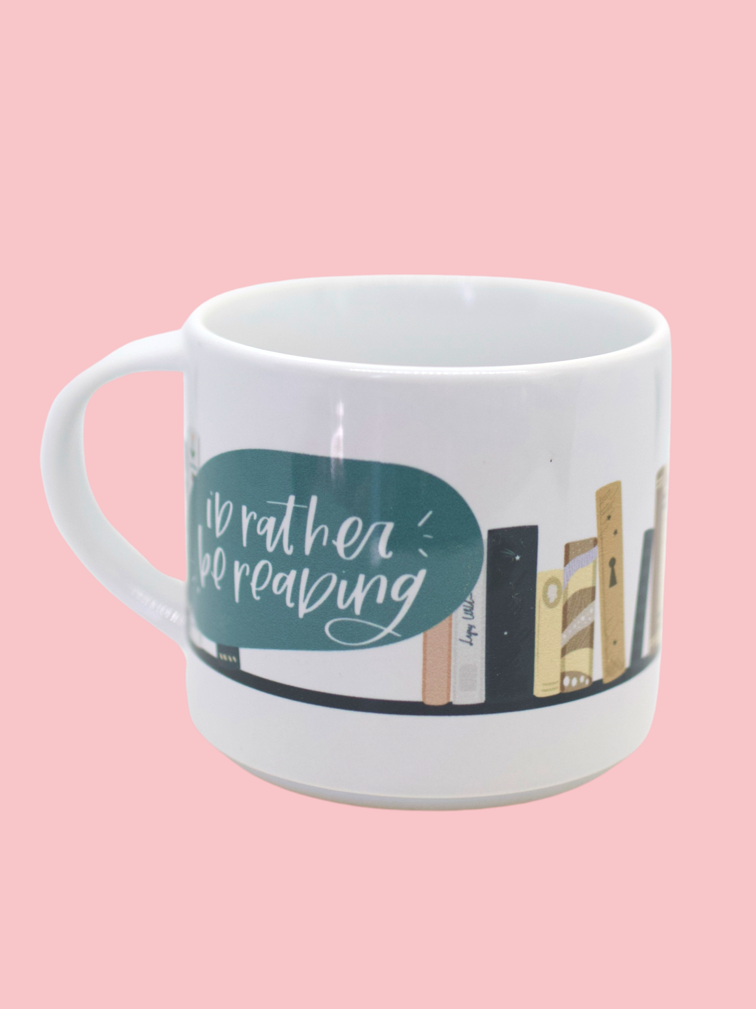 Glossy white mug with 'i'd rather be reading' and book graphic print wrapped around the mug
