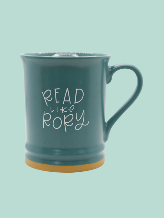 A matte teal ceramic mug with 'READ LIKE RORY' printed in white on the side.