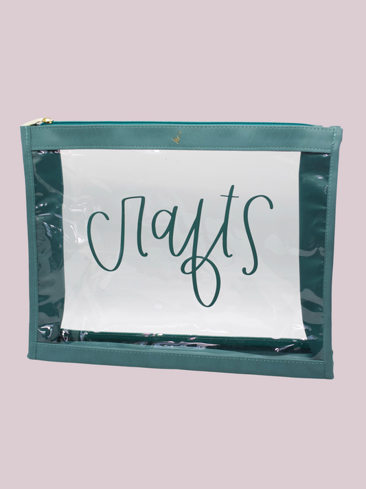 A clear vinyl organizer pouch with teal trim, labeled 'crafts' on the front, designed to hold various craft materials.