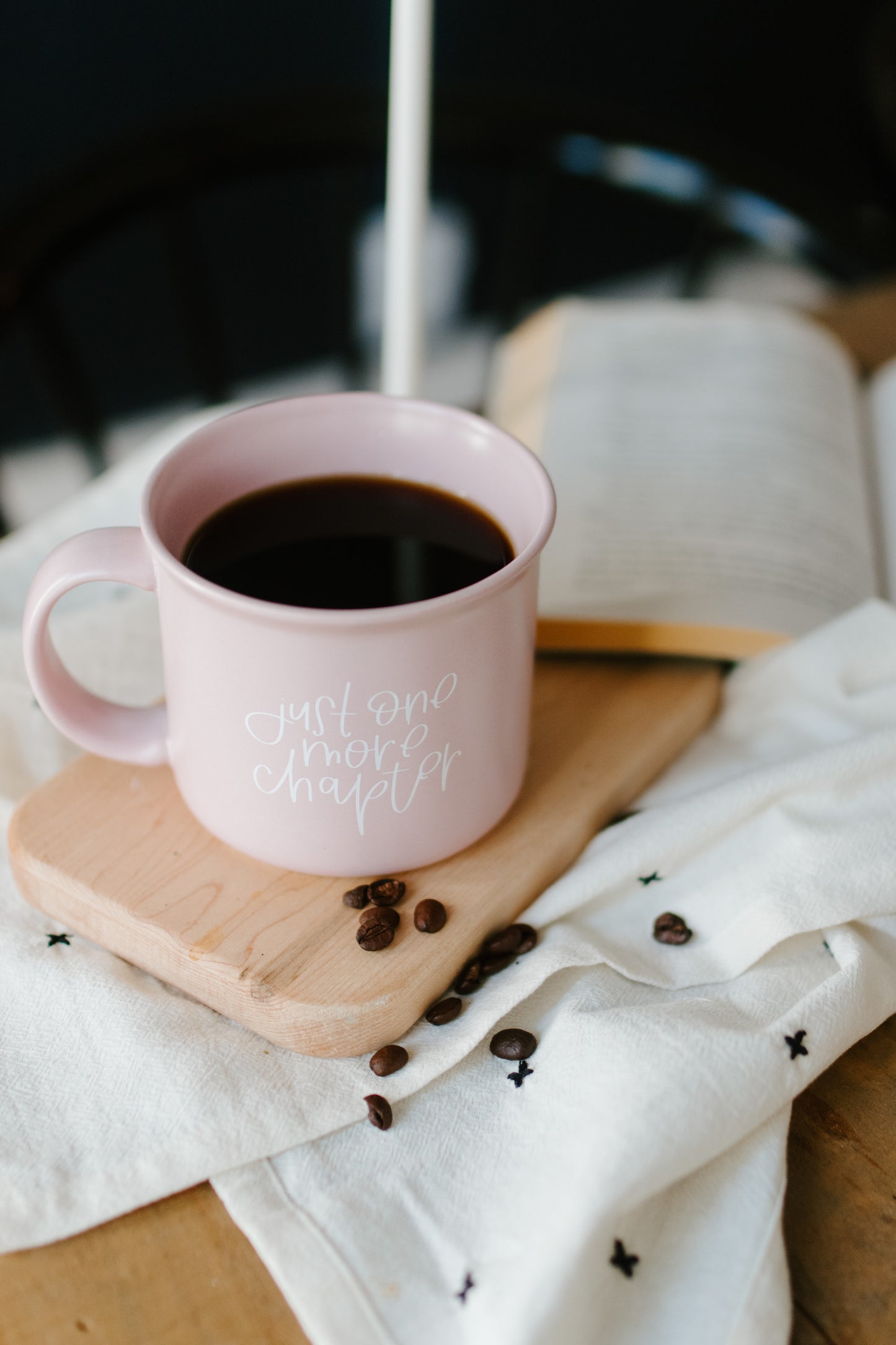 A matte lilac ceramic mug with the phrase 'Just One More Chapter' printed in white on the side.