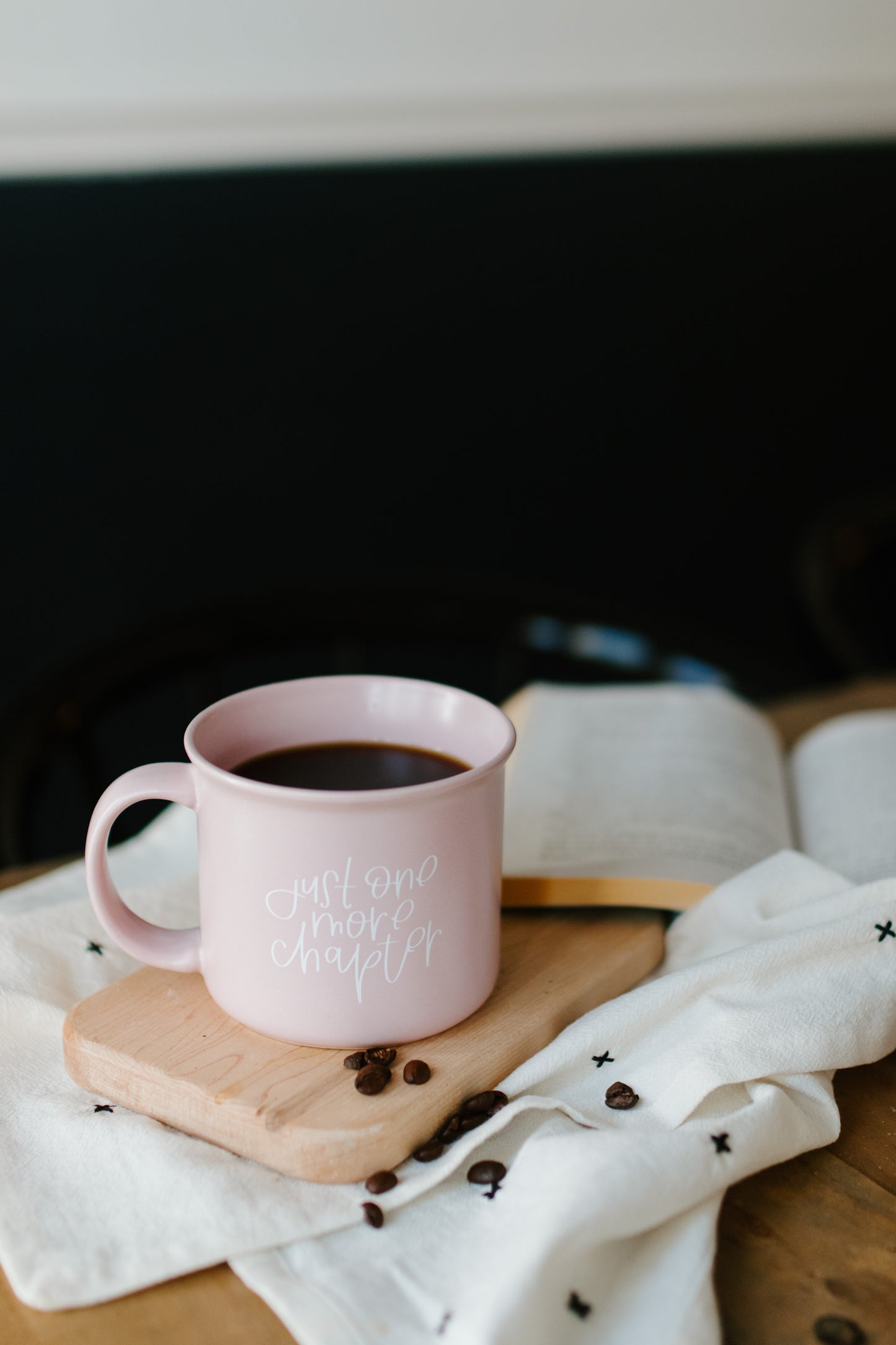 A matte lilac ceramic mug with the phrase 'Just One More Chapter' printed in white on the side.