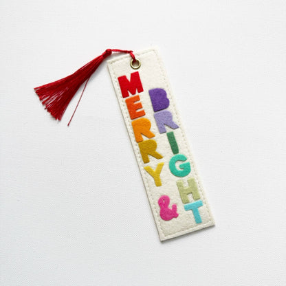Colorful embroidered bookmark with tassel on a white background