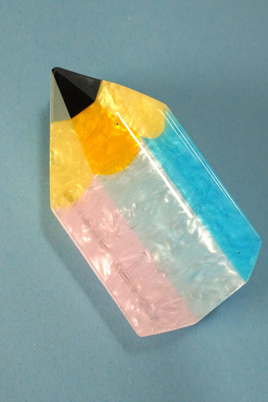 Pencil Hair Clip with black, yellow, pink, and blue colors 