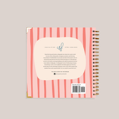 Back cover of a spiral-bound notebook with pink and white striped design and text.
