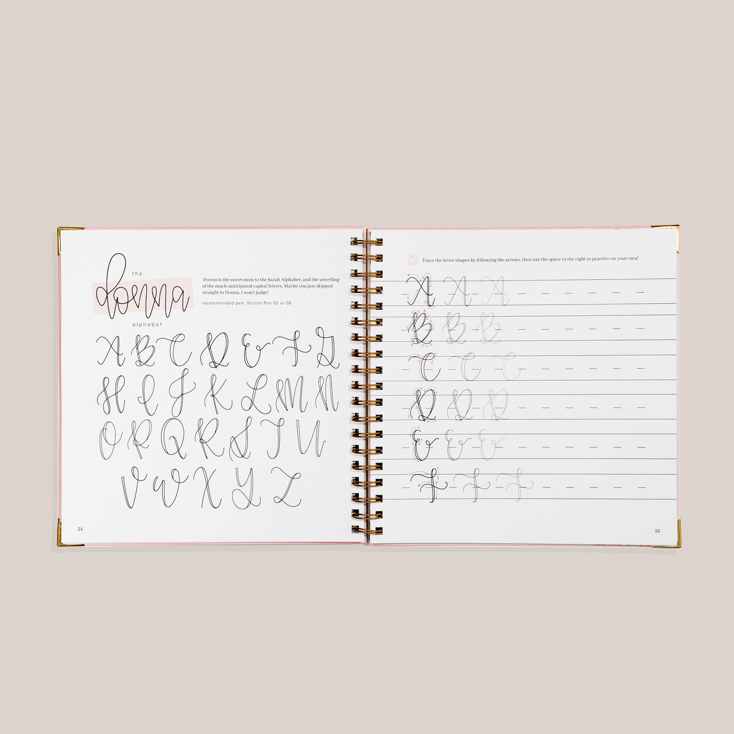 Open view of 'Modern Calligraphy' with calligraphy practice pages on a beige background 