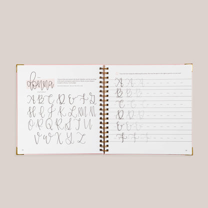 Open view of 'Modern Calligraphy' with calligraphy practice pages on a beige background 