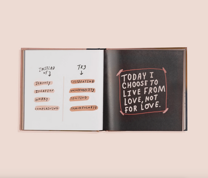 Open YOU ARE LOVED book with motivational text on a light pink background