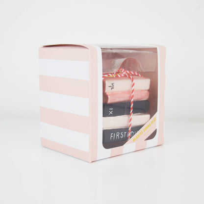 Gift set in a clear box with pink and white striped design on a light gray background