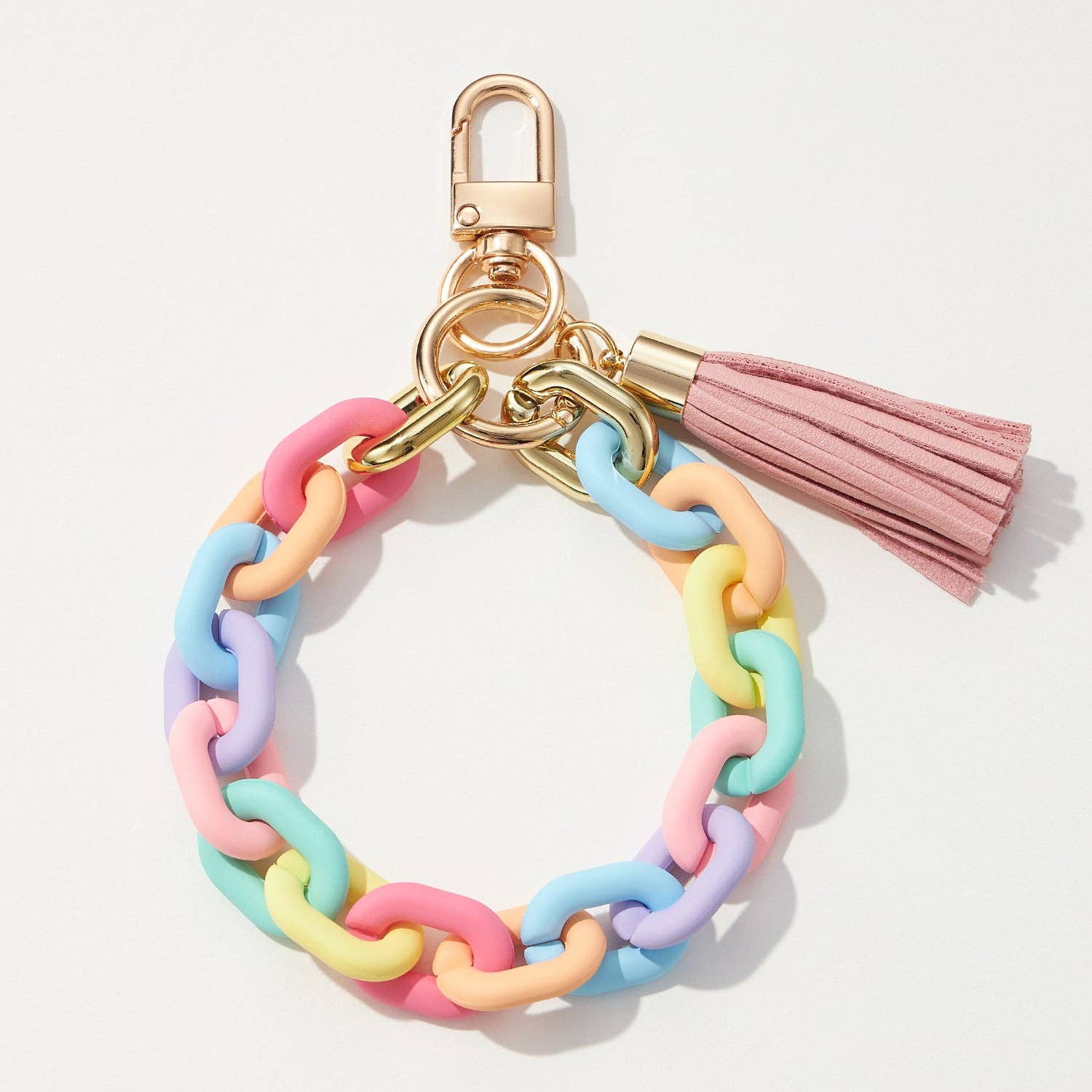 Colorful chain keychain with a pink tassel on a light gray background