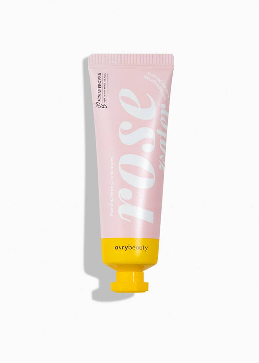 Pink and yellow tube of 'Rose' lotion by avry beauty on a white background