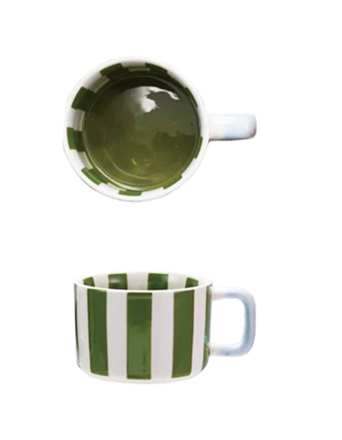 Mug with green vertical stripes, light blue handle, and green interior